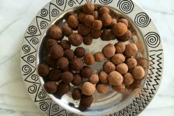 Small chocolate rounds in a silver bowl